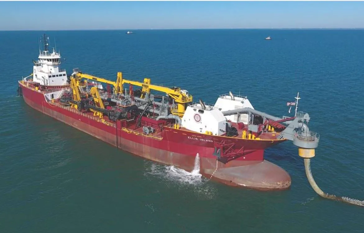 Dredging equipment operating beside a shoreline
